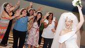 One of these ladies is about to win a honeymoon in London! Mamma Mia! star Brandi Burkhardt tosses the bouquet.