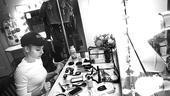 Kerry Butler studies the (vast) array of cosmetics that will transform her into a sexy but naive newcomer to the Sunset Strip.