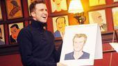 Here&rsquo;s the moment of truth! Gavin Creel is understandably delighted at his (super-cute) caricature.