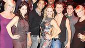 A more serious pose from some seriously talented dancers, surrounding Burn the Floor stars Anya Garnis (in silver sparkles) and Pasha Kovalev (in black vest).