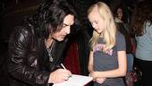 Adorable tutu-wearer Danika Yarosh bravely approaches one of the kings of rock for his autograph (and he's happy to oblige).