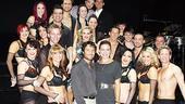 Alec Mazo and Natalie Coughlin pose front and center with the only group of people in New York who are in as good shape as they are: the Broadway cast of Burn the Floor!