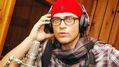 Cheyenne Jackson is fully accessorized (scarf, hat, glasses!) and ready to croon.