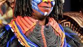 A closer look at Whoopi in her colorful Rafiki get-up (plus her own glasses!).