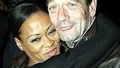 Hey, maybe I'm leaving the show too soon! Lewis receives a so-long hug from incoming star, Robin Givens.