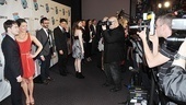 The cameras start flashing as How to Succeed stars Daniel Radcliffe and Rose Hemingway make their entrance. 