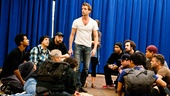 The company is on its knees as Paul Nolan makes his first entrance as Jesus.