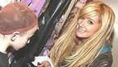 Can I have your autograph, please?Tisdale signs the chart-topping soundtrack of High School Musical for Braun.