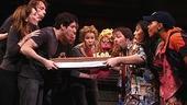 Photo Op - Avenue Q plays 1,500 performance - cast blows out cake candles