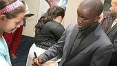 Elijah Kelley happily autographs his fan... for a fan.
